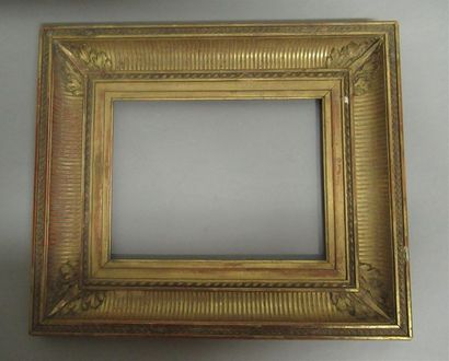 null Wooden frame and gilded stucco called "à cannaux" with friezes of ribboned stems,...