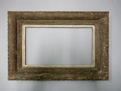 null Carved, painted and patinated wood frame with stylized decoration of dentil...