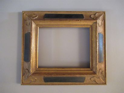 null Wooden frame and gilded resin, blackened with an inverted profile and decorated...