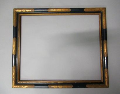 null Moulded, gilded and black-painted wooden frame with stylised decoration of acanthus...