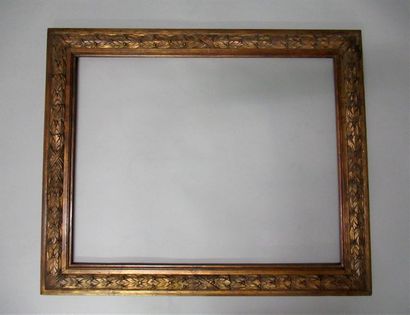 null Carved wood frame, gilded with copper and patinated with large ribboned laurel...