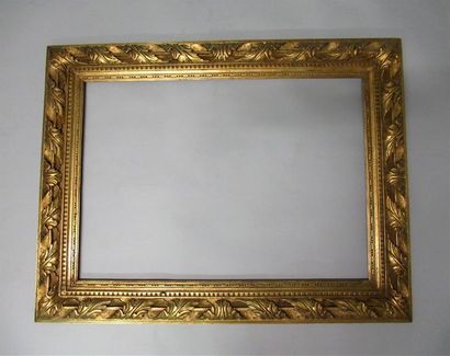 null Carved, gilded and patinated wooden frame with a grape, pearl and olive decoration,...