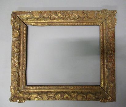 null Sculpted oak frame, gilded and decorated with sticks, bases and acanthus leaves.
Louis...