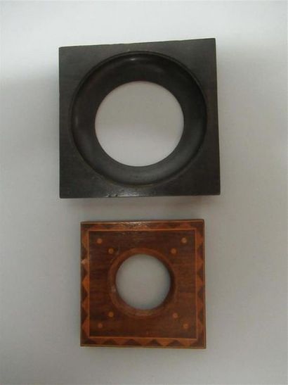null Set of two round view frames, one in monoxyl blackened wood and the other in...