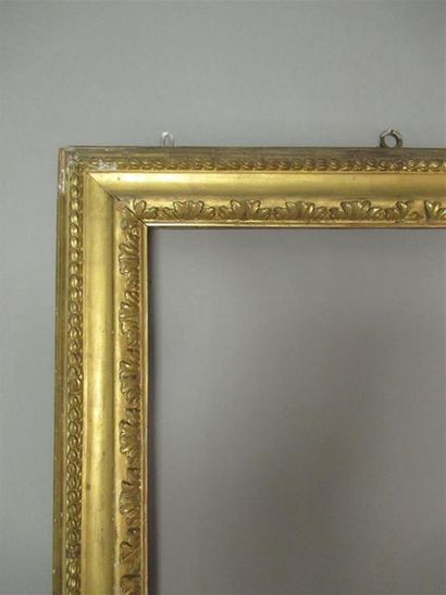 null Large carved pine wood frame, gilded with an inverted profile with stylized...