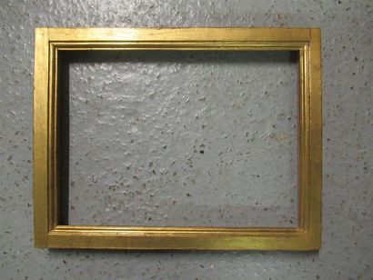 null Molded gilded wood frame with a flat and soft profile, the top and bottom curved.
Style...