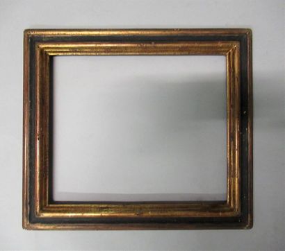 null Moulded, gilded and black painted wood frame with inverted profile.
Italian...
