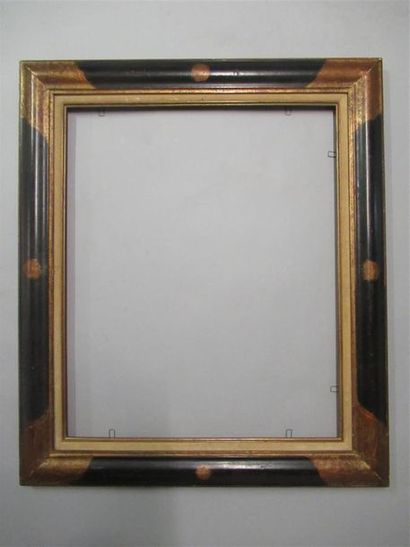 null Wooden frame with gilded, blackened and patinated moulded frame with stylised...