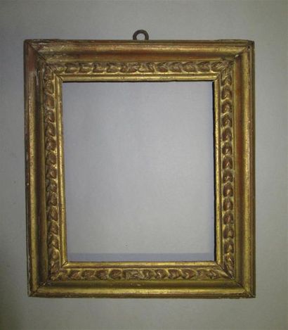 null Carved giltwood frame with an inverted profile and a frieze of bases.
Italy,...