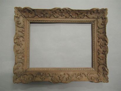 null Waxed carved natural wood frame called "Montparnasse" with stylized decoration...