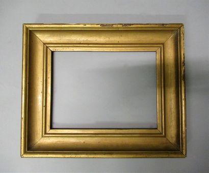 null Moulded wood frame gilded and bronzed with a profile of throat and rush
19th...