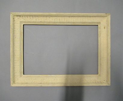 null Frame in moulded wood with a soft profile, painted off-white and patinated with...