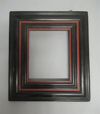 null Moulded wood frame with inverted profile veneered with blackened wood and red...