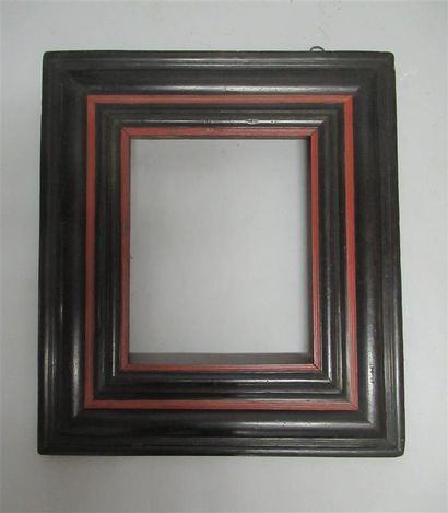 null Molded wooden frame with inverted profile veneered with blackened wood and painted...