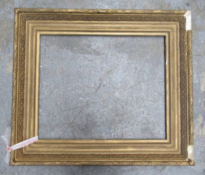 null A "Barbizon" frame in wood and bronzed stucco decorated with heart and pearl...