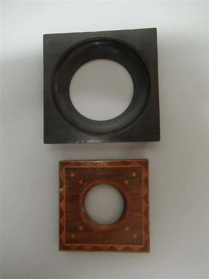 null Set of two round view frames, one in monoxyl blackened wood and the other in...