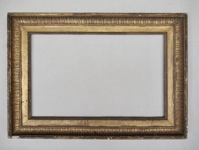 null Wood and gilded paste frame decorated with rais de coeur and friezes of water...