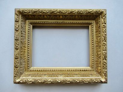 null Wooden frame and gilded stucco called "Barbizon" decorated with pearl grapes,...