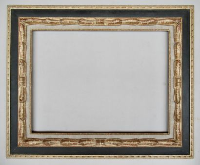 null Gilded wood and resin frame, painted black and patinated with a profile called...