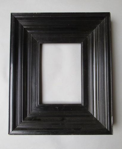 null Moulded pine frame with ebony veneer, flat profile, staves and successive rushes.

Netherlands,...