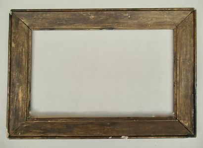 null Molded wood frame, bronzed on the old gilding with a slope profile framed by...