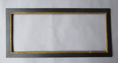 null Carved, gilded and blackened wood frame with flat profile and ribbon frieze.

Italy,...