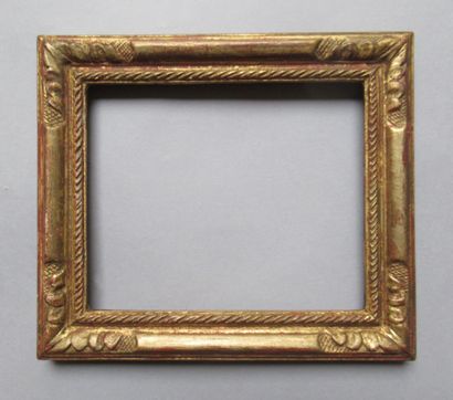 null Carved and gilded wood frame decorated with ropes and acanthus leaves.

Louis...