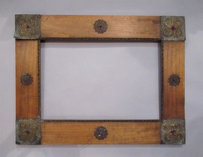 null Natural pitchpin frame with flat profile plated with Moorish style metal ornaments...