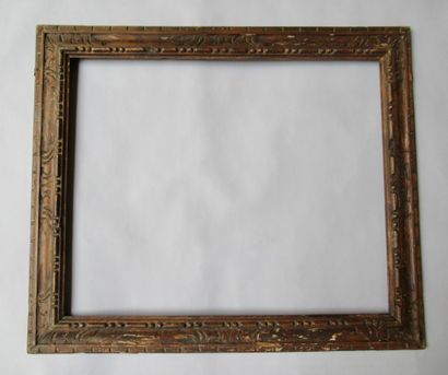 null Carved wooden frame with inverted profile, formerly painted and patinated, with...