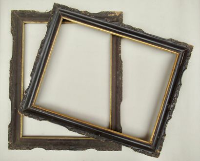 null Pair of carved wood frames painted faux rosewood and gilded with stylized decorations...