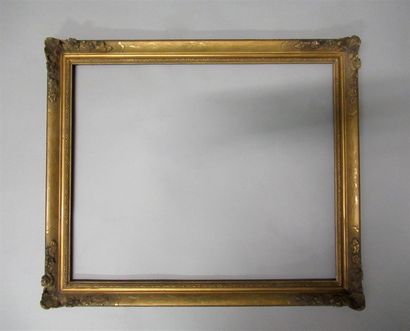 null Wooden frame and gilded stucco "with flowered corners" decorated with reparure...