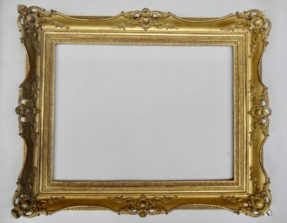 null Wood and gilded stucco frame decorated with friezes, sandblasted plate, cartouches,...
