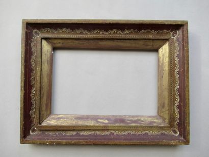 null Wooden frame gilded with copper and painted red with engraved decoration of...