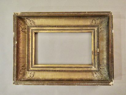 null Wooden frame and gilded paste called "with channels" decorated with grapes of...