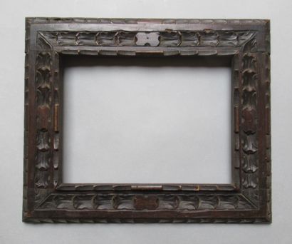 null Carved wooden frame with inverted profile, stained walnut with stylized decoration...