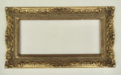 null Wooden frame with gilded stucco and patina, decorated with friezes, sandblasted...