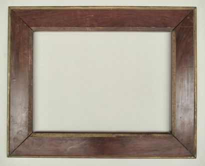 null Walnut frame with natural and gilded mouldings, wide flat and sloping at the...