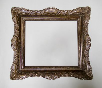 null Wood and stucco frame with patina, decorated with culottes, crosses, shells...