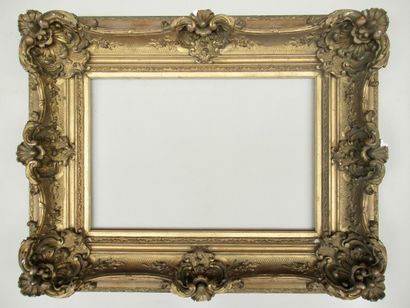 null Wood and gilded stucco frame decorated with friezes, ribboned stems, flowers,...