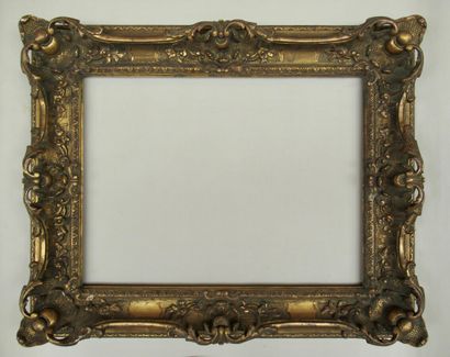 null Wood and gilded stucco frame decorated with friezes, shells, crosses and flowers

Louis...