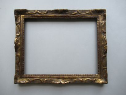 null Wood and gilded stucco frame with stylized decoration of crosses and acanthus...