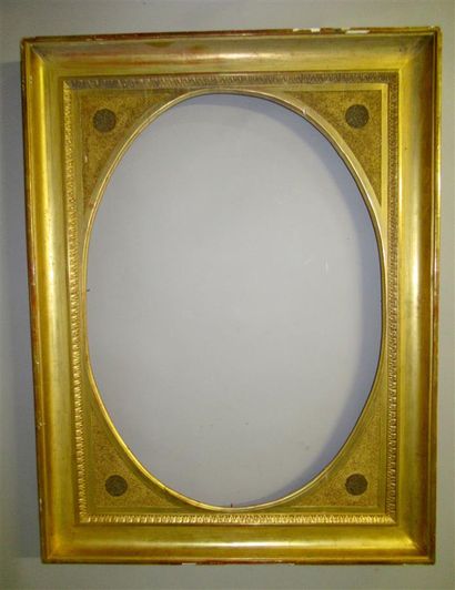 null Wooden frame, moulded and gilded with an oval view, decorated with a frieze...