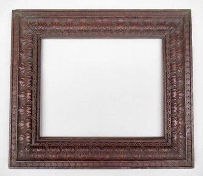 null Carved and waxed natural oak frame with inverted profile, decorated with ribbons,...