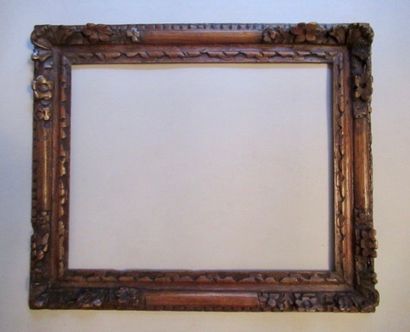 null Carved and waxed natural oak frame with stylized decoration of friezes, palmettes,...