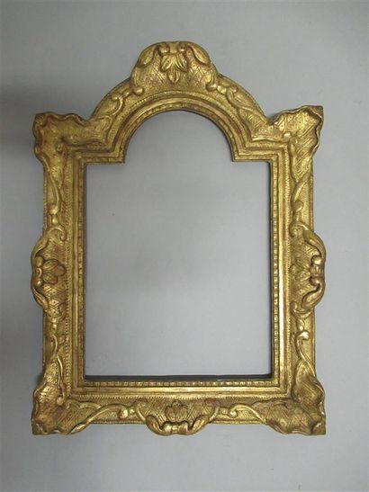 null Carved wooden frame, gilded "Christ" decorated with shells, bases and crosses.

Louis...