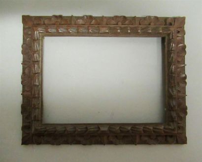 null Frame in natural walnut monoxyl carved and waxed with stylized decoration of...