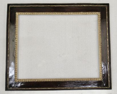 null Carved, gilded and varnished wood frame called "à cassetta" decorated with friezes...