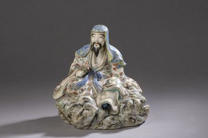 null Subject in cracked and polychrome earthenware representing a scholar sitting...