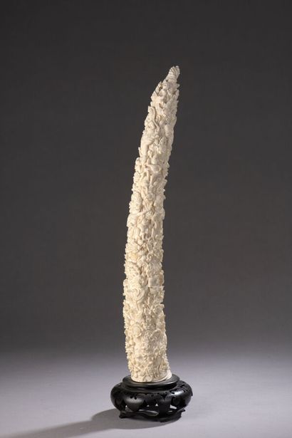 null Tusk in ivory carved with many characters and deities. Indonesia, 20th century....