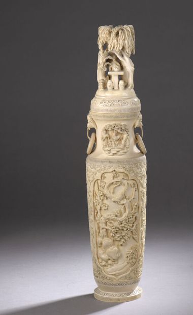 null Covered baluster vase in carved ivory decorated with medallions of a bird on...